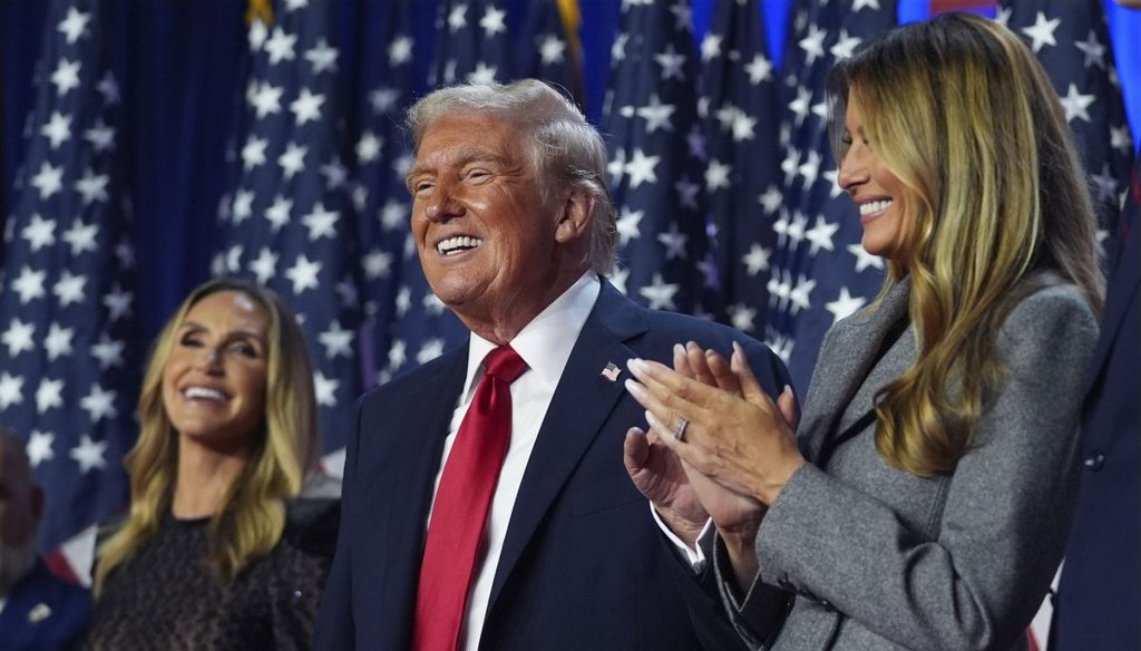 Former President Donald Trump on stage with former first lady Melania Trump, as Lara Trump watches, at an election night watch party in West Palm Beach, Fla., on Nov. 6, 2024. (AP)