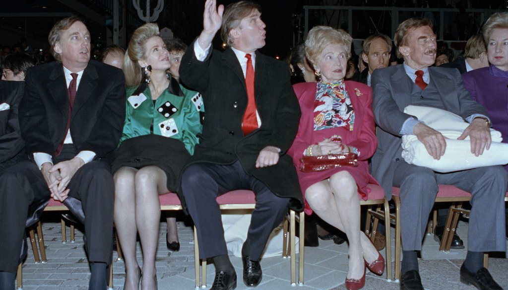 In this April 5, 1990, photo, Donald Trump sits with family members, including his father Fred, second from right, during opening ceremonies of the Trump Taj Mahal Casino Resort in Atlantic City, N.J. (AP)