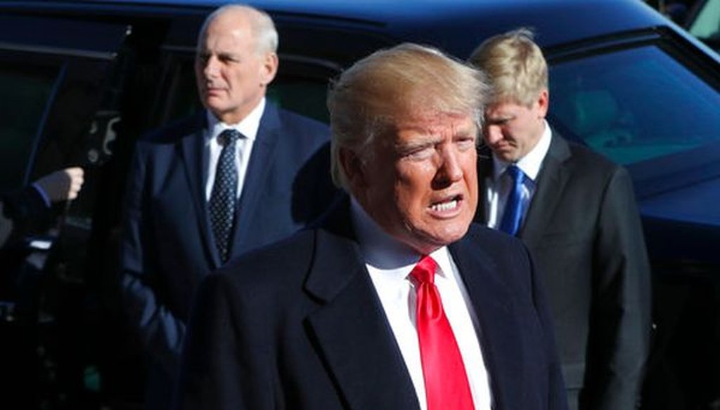 President Donald Trump makes remarks while arriving at the Pentagon on Jan. 18, 2018. Standing behind him is White House Chief of Staff John Kelly. (AP/Pablo Martinez Monsivais)