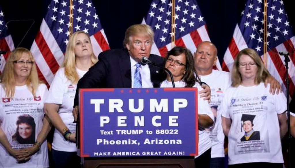 Donald Trump with "Angel Moms," parents who say their children were killed by illegal immigrants, during a campaign event focused on immigration policy in Phoenix on Aug. 31, 2016. (Travis Dove/The New York Times)