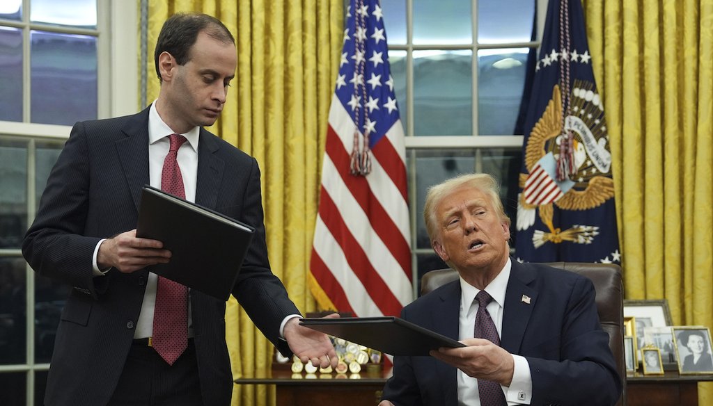 President Donald Trump signs executive orders in the Oval Office of the White House on Jan. 20, 2025 (AP)