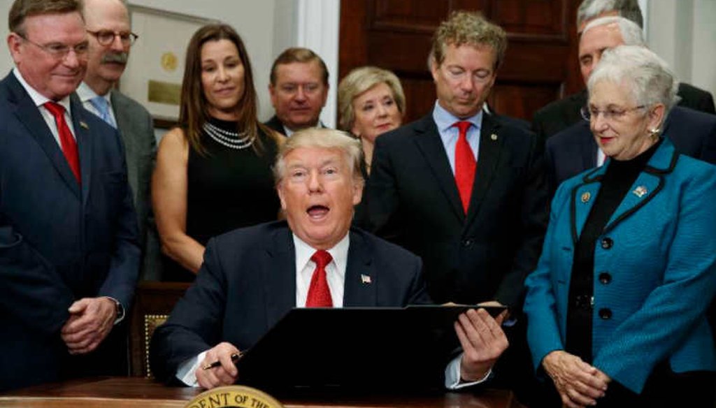 President Donald Trump signs executive order to expand association health plans. (AP)