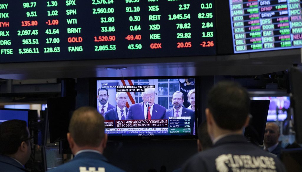 Traders listen at the New York Stock Exchange to President Donald Trump's televised remarks from the White House, March 13, 2020, in New York. (AP )