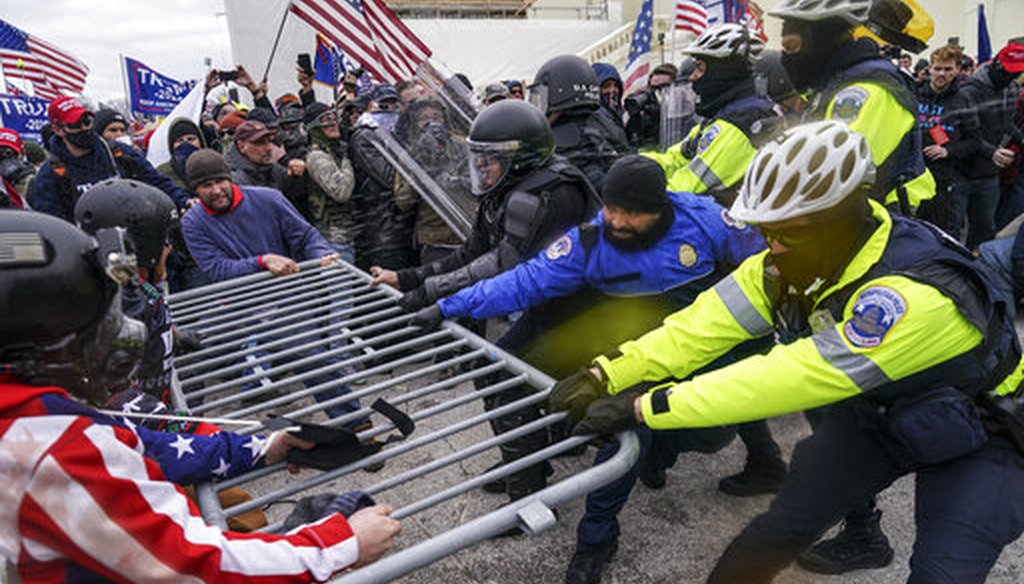 Trump supporters try to break through a police barrier, Wednesday, Jan. 6, 2021, at the Capitol in Washington. (AP)