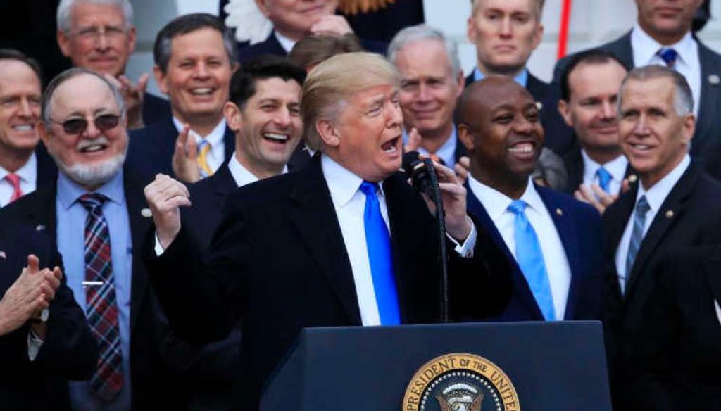President Donald Trump celebrates passage of major tax legislation but health savings accounts supporters say it held no changes for them. (AP)