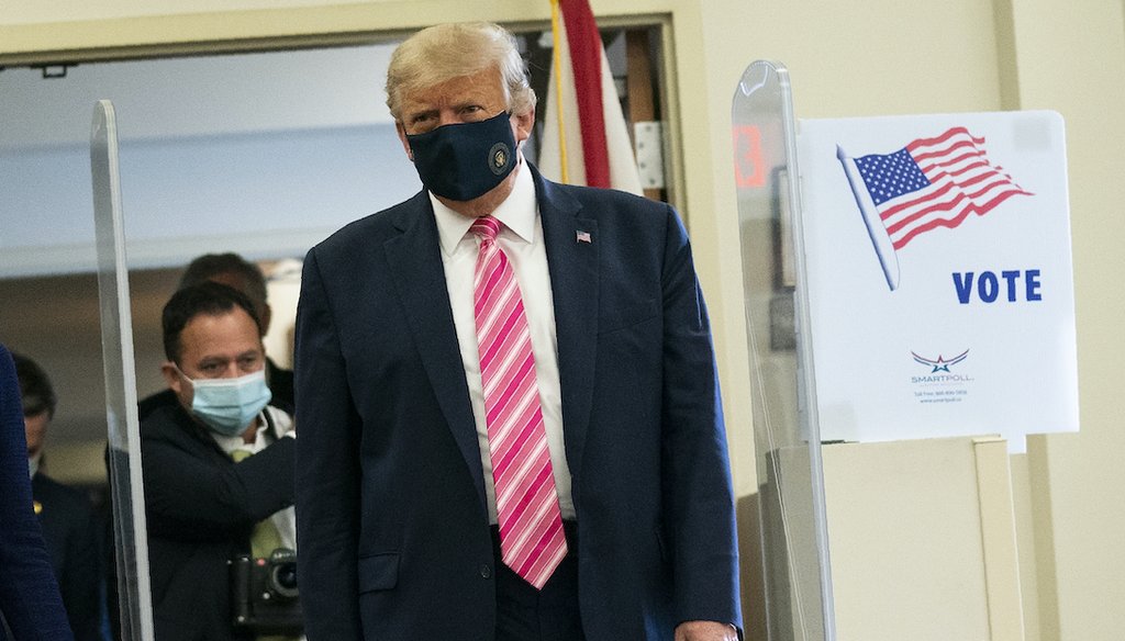 President Donald Trump walks to speak with reporters after voting at the Palm Beach County Main Library, Saturday, Oct. 24, 2020, in West Palm Beach, Fla. (AP)