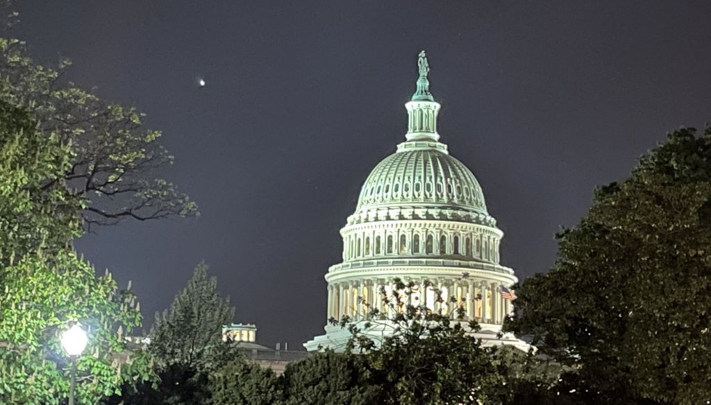 The U.S. Capitol at night, April 15, 2023. (Louis Jacobson / PolitiFact)