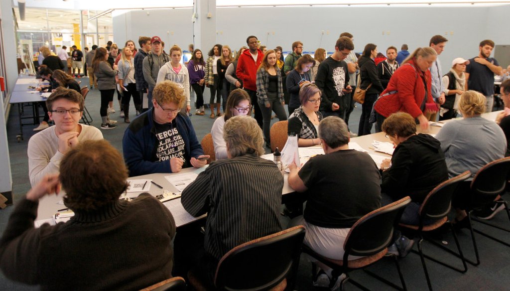 Students at the University of Wisconsin-Milwaukee register to vote on Nov. 8, 2016 before casting ballots in the presidential election. (Pat A. Robinson/Milwaukee Journal Sentinel)