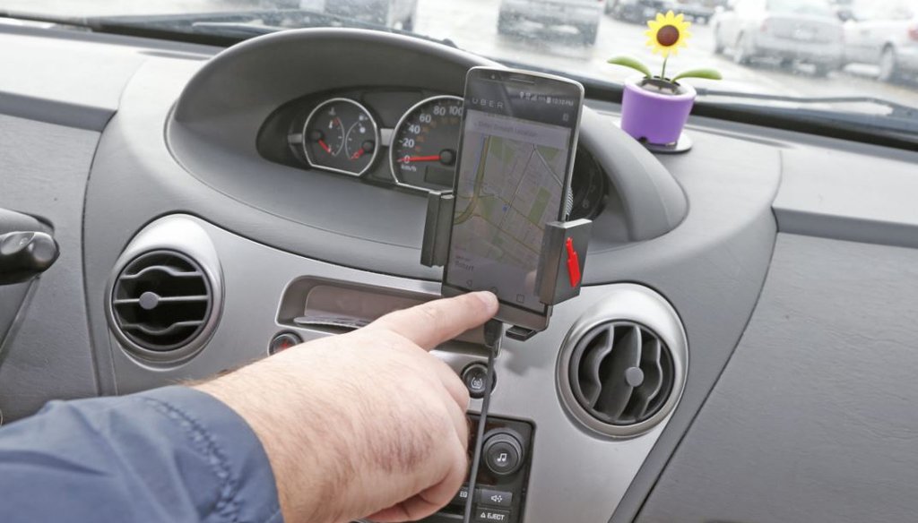 Uber uses a mobile app to link passengers with drivers. State legislature approval would be required to expand the service upstate. (Robert Kirkham/Buffalo News)