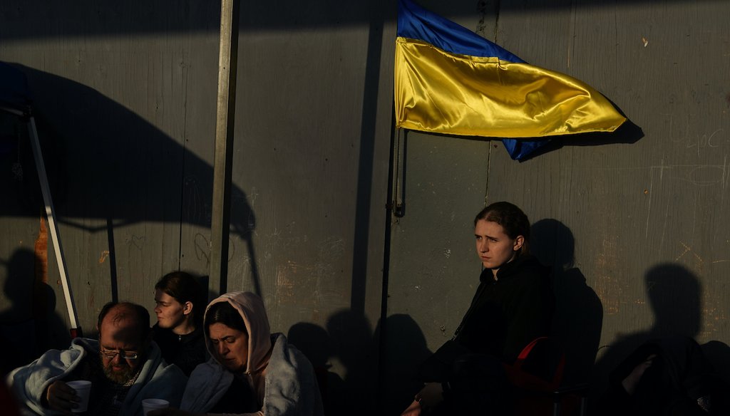 Ukrainians wait near the U.S. border on April 4, 2022, in Tijuana, Mexico. (AP)