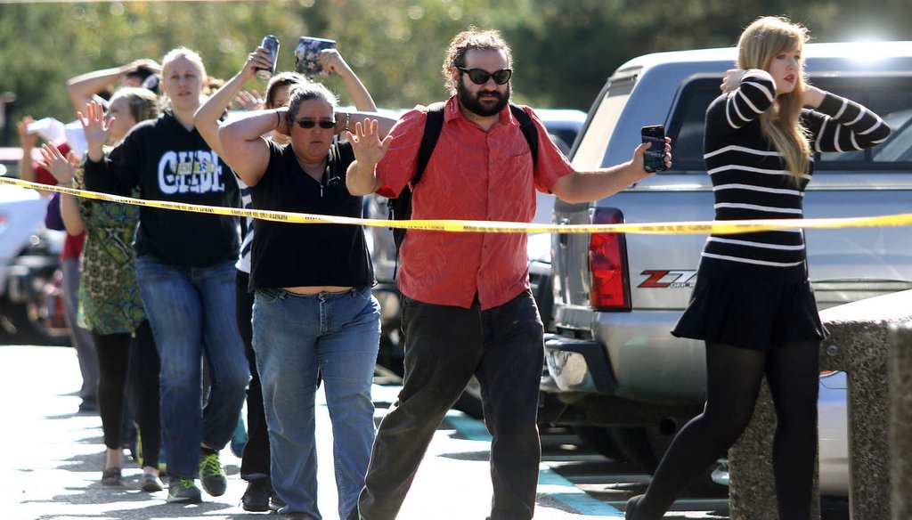 Students, staff and faculty are evacuated from Umpqua Community College in Roseburg, Ore., after a deadly shooting there. (AP)