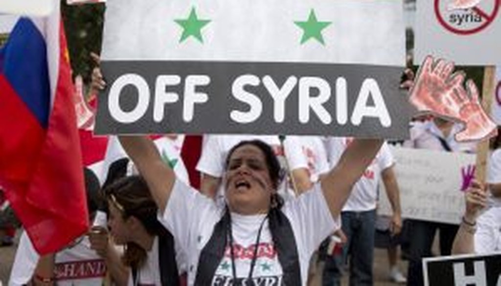 Protesters against U.S. military action in Syria shout during a demonstration in front of the White House on Monday. On Tuesday, President Barack Obama will address the nation regarding Syria. (AP Photo/Carolyn Kaster)