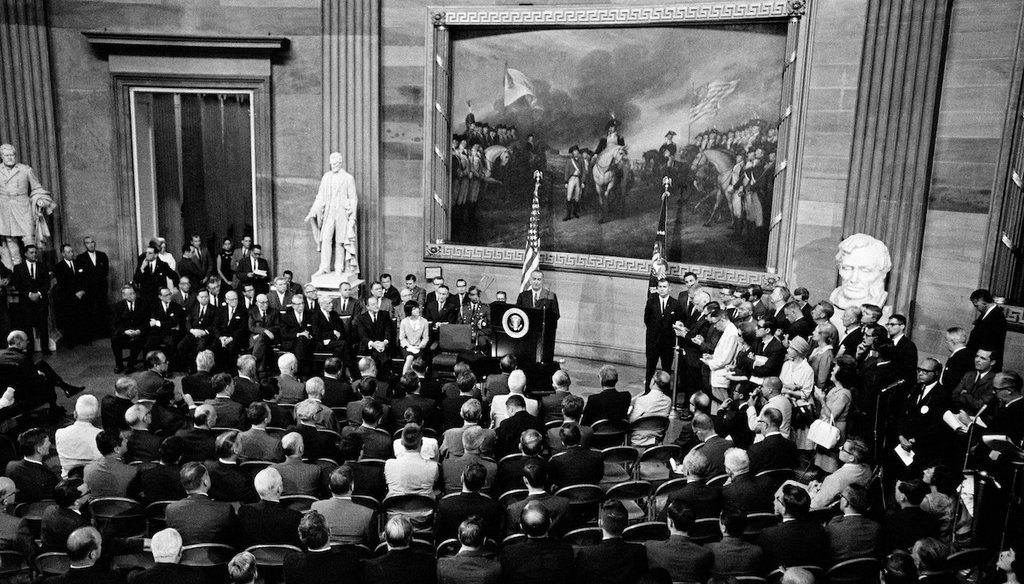 President Lyndon Johnson speaks in the rotunda of the Capitol in Washington, before signing the Voting Rights Act, Aug. 6, 1965. (AP)