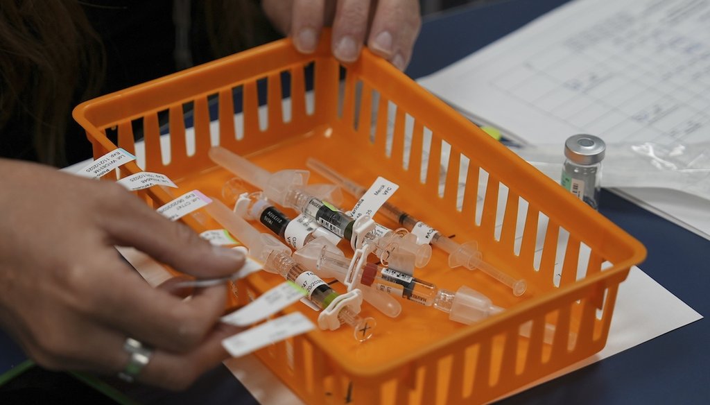 Vaccines are prepared for students during a pop-up immunization clinic at the Newcomer Academy in Louisville, Ky., on Aug. 8, 2024. (AP)