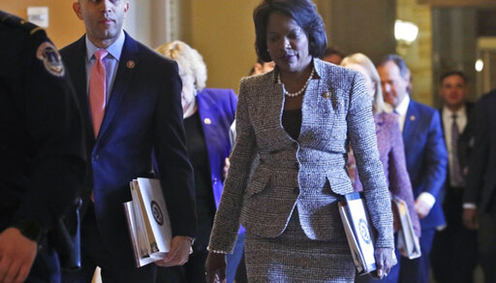 House Democratic impeachment managers, Rep. Hakeem Jeffries, D-N.Y., left, and Rep. Val Demings, D-Fla., right, walk to the Senate chamber for the impeachment trial of President Donald Trump at the Capitol Wednesday Jan 29, 2020, in Washington. (AP_