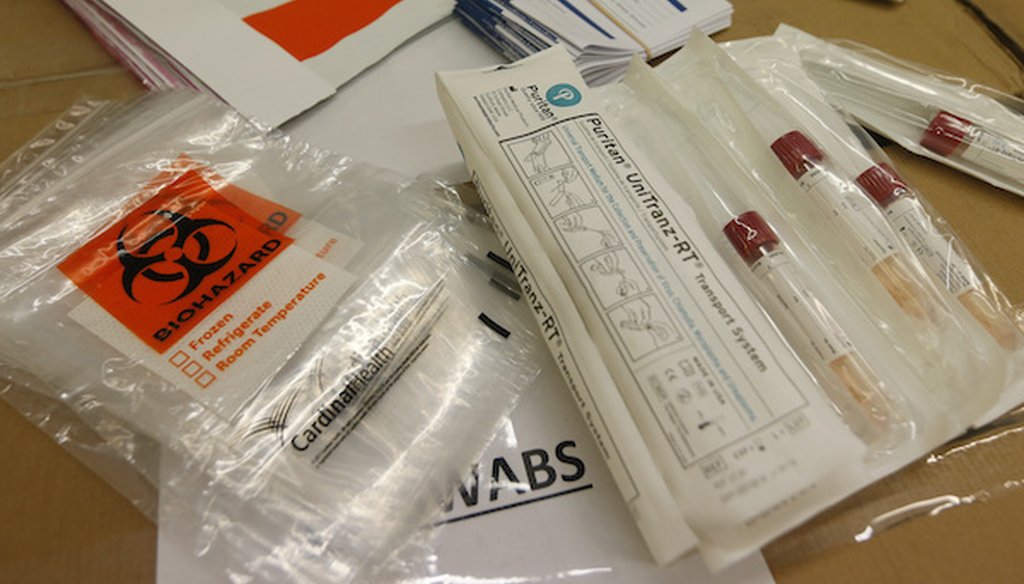 COVID-19 test kits are prepared at the Genetworx clinical lab Wednesday March 25 , 2020, in Glen Allen, Va. (Associated Press)