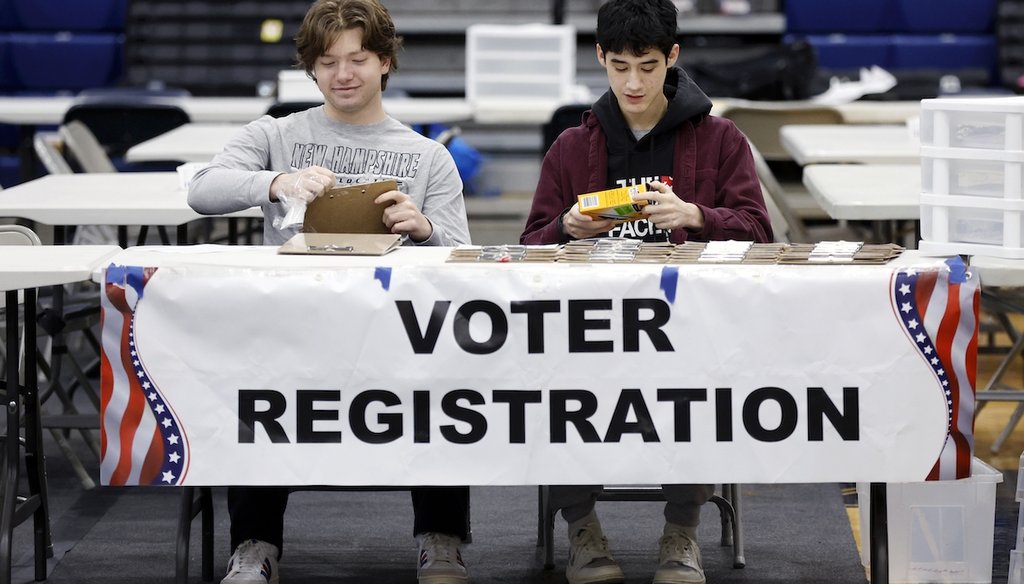 High school students volunteer at the voter registration table for the presidential primary election on Jan. 23, 2024, in Windham, N.H. (AP)