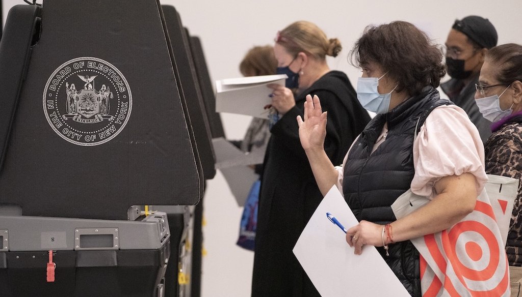 Voters cast their ballots using electronic counting machines at a polling site inside The Shed arts center, Nov. 8, 2022, in the Hudson Yards neighborhood of the Manhattan borough of New York. (AP)