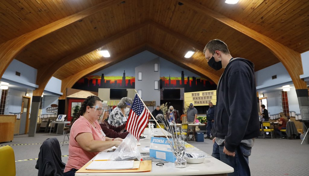 Voters across the country, like this man in Idaho, went to the polls. (AP Photo/Otto Kitsinger)
