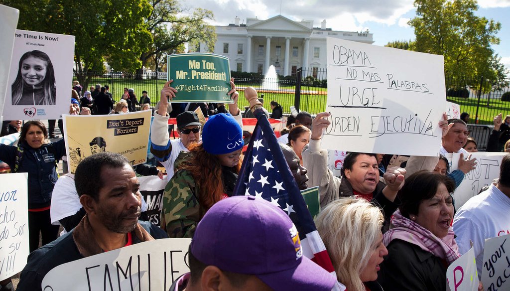 People rally for comprehensive immigration reform, Friday, Nov. 7, 2014, outside of the White House. With executive action to defer deportations on the table, Republicans are split on how to respond. (AP Photo)