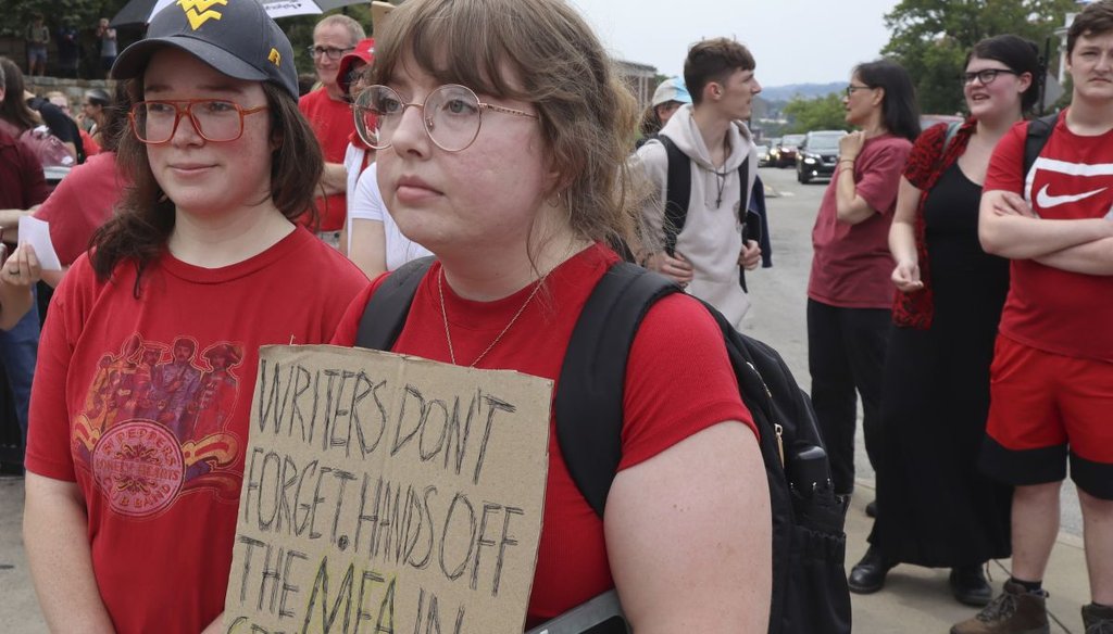 West Virginia University creative writing master's student Kelly Ward and alumna Anna Schles attend a protest against proposed cuts on Aug. 21, 2023. (AP)