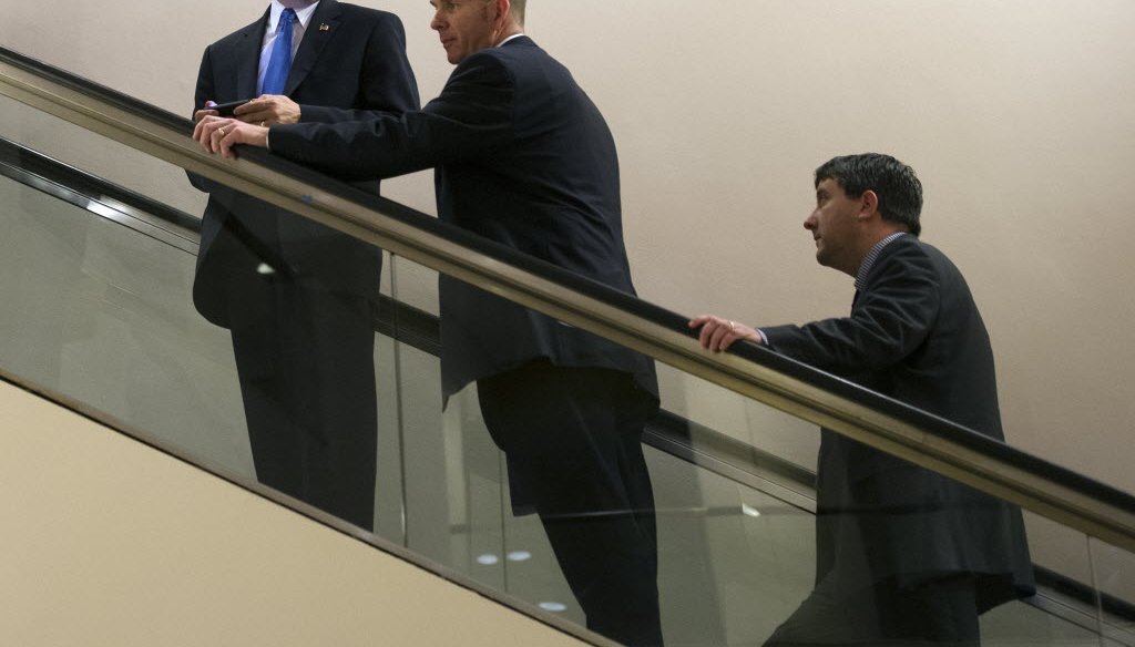 Wisconsin Gov. Scott Walker, left, leaves a meeting during the National Governors Association winter meeting in Washington, D.C., on Feb. 22, 2014