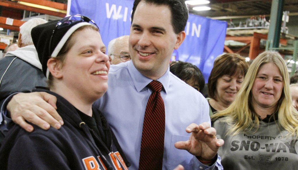 Gov. Scott Walker will welcome the National Governors Association convention in Milwaukee this weekend. In this Associated Press photo from January 2013, Walker visited a factory in Hartford, Wis.