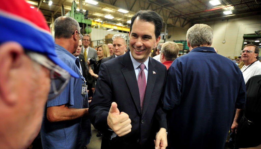 Our analysis of how Gov. Scott Walker, shown in this AP photo at a Racine plant, has started talking about jobs was our most-clicked item for May 2014.