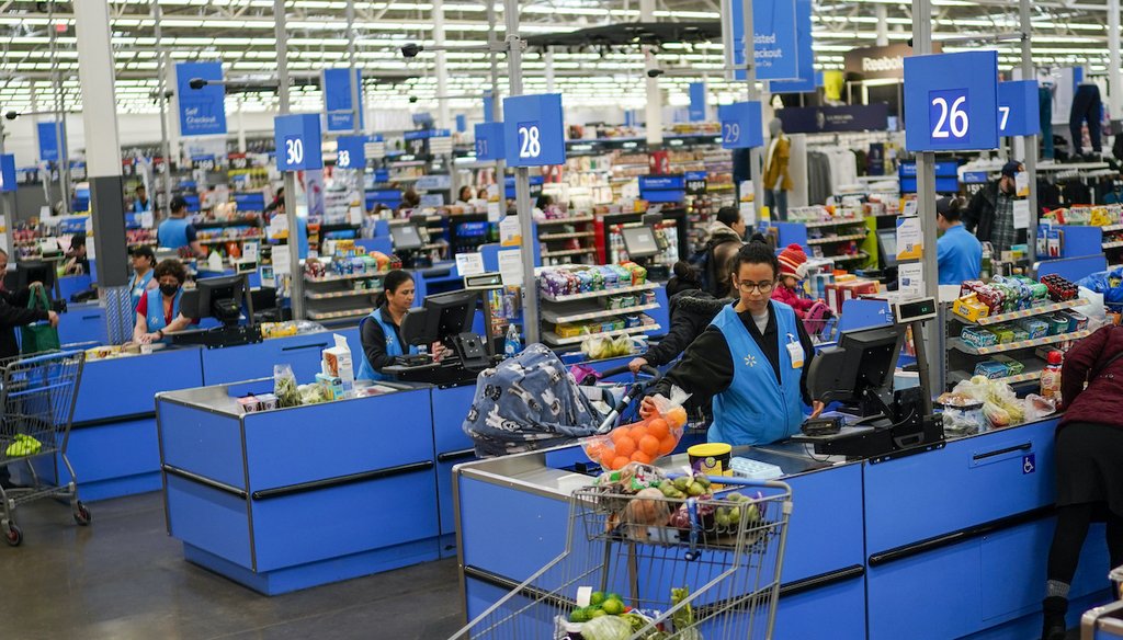 Cashiers process purchases at a Walmart Supercenter in North Bergen, N.J., on Thursday, Feb. 9, 2023. (AP)