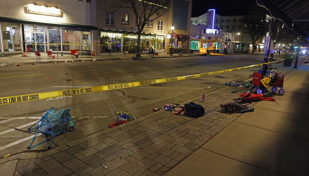 Police tape cordons off a street in Waukesha, Wis., after a vehicle plowed into a Christmas parade on Nov. 21, 2021. A video clip from the incident is used in one of the 2022 election ads that highlight violent crime. (AP)