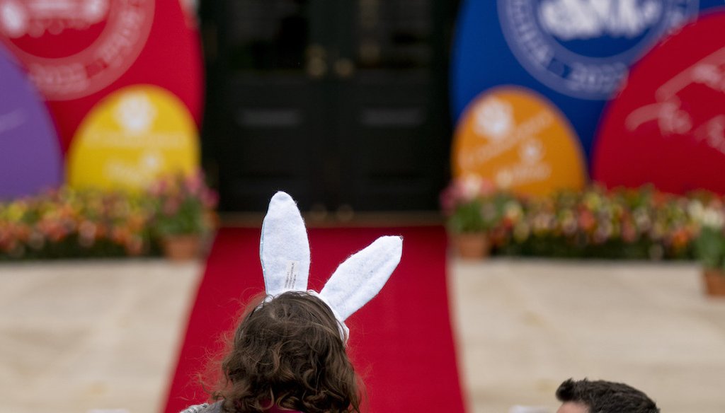 A girl wears bunny ears before President Joe Biden appears with first lady Jill Biden and the Easter Bunny on April 18, 2022, at the White House. (AP)