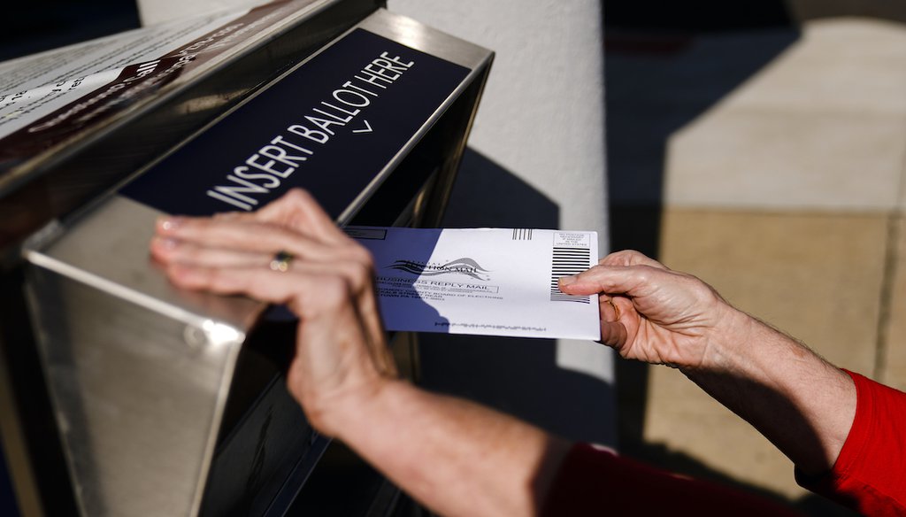 A person drops off a mail-in ballot at an election ballot return box in Willow Grove, Pa., Oct. 25, 2021. (AP)