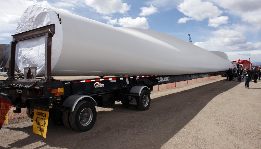 In this 2009 photo, a Vestas wind turbine blade sits on the back of a flatbed trailer near Brighton, Colo. (AP)