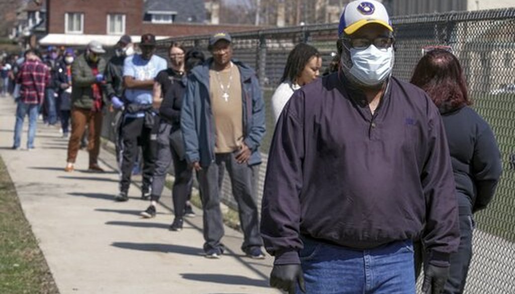 In this April 7, 2020 file photo, voters observe social distancing guidelines as they wait in line to cast ballots in the presidential primary election in Milwaukee. (AP)