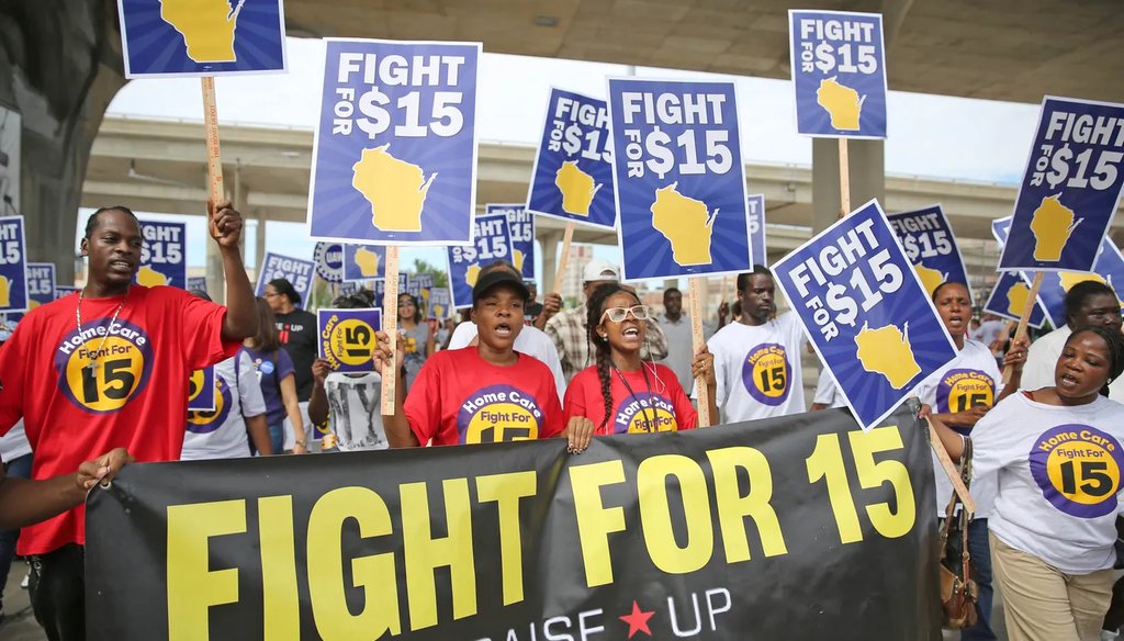 Members of the Wisconsin Jobs Now Group, representing Fight for 15, which favors a $15 an hour minimum wage, march shortly before entering the Summerfest grounds for Labor Fest in 2015. (Mike DeSisti/Milwaukee Journal Sentinel