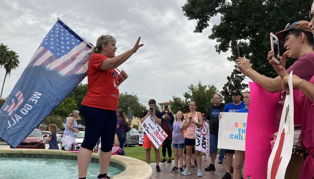 Suzanne Carter addresses a protest against child trafficking in Munn Park of downtown Lakeland, Fla., on Aug. 22, 2020. (Steve Contorno)