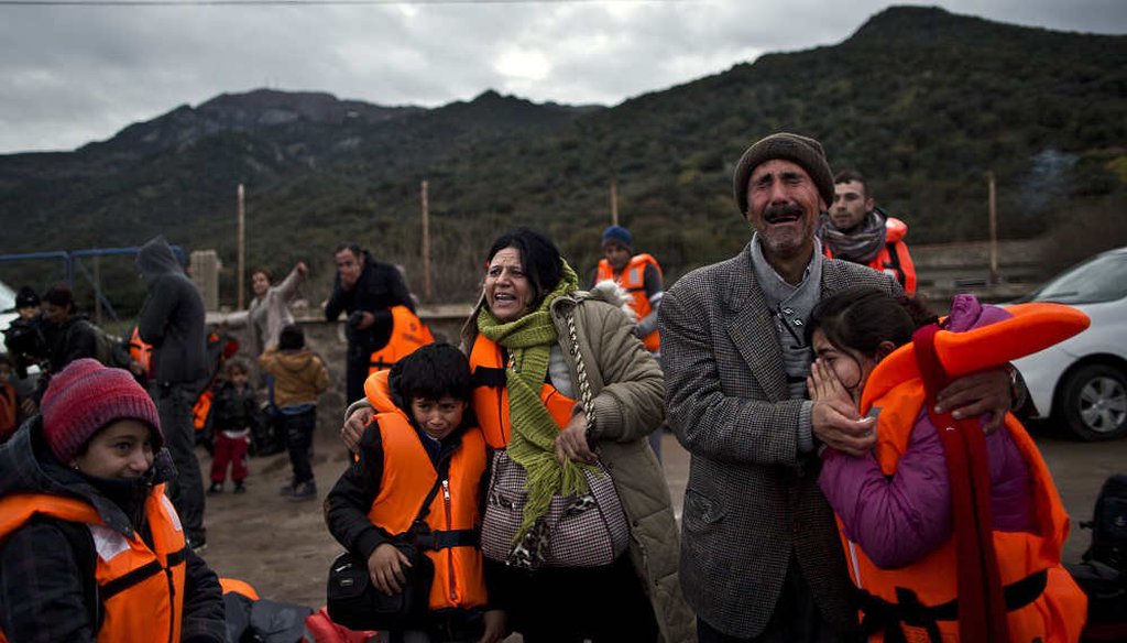 A Yazidi refugee family from Iraq, cry and embrace shortly after arriving on the Greek island of Lesbos in 2015. (AP)