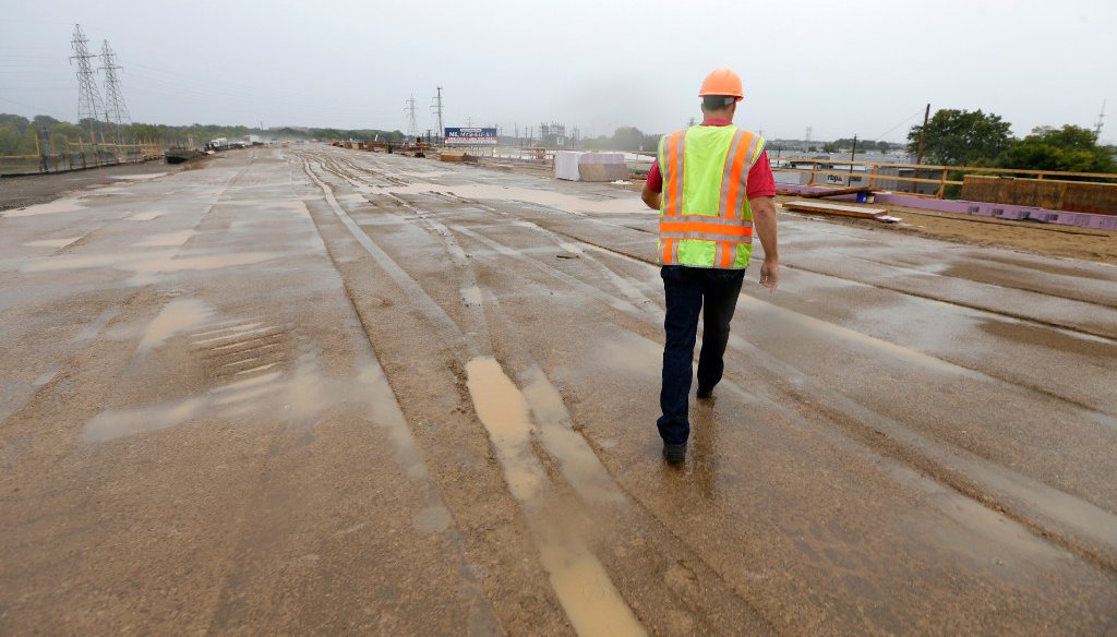 A Wisconsin Department of Transportation project manager walks along part of the Zoo Interchange reconstruction in the Milwaukee area in September 2016. (Mike De Sisti/Milwaukee Journal Sentinel)