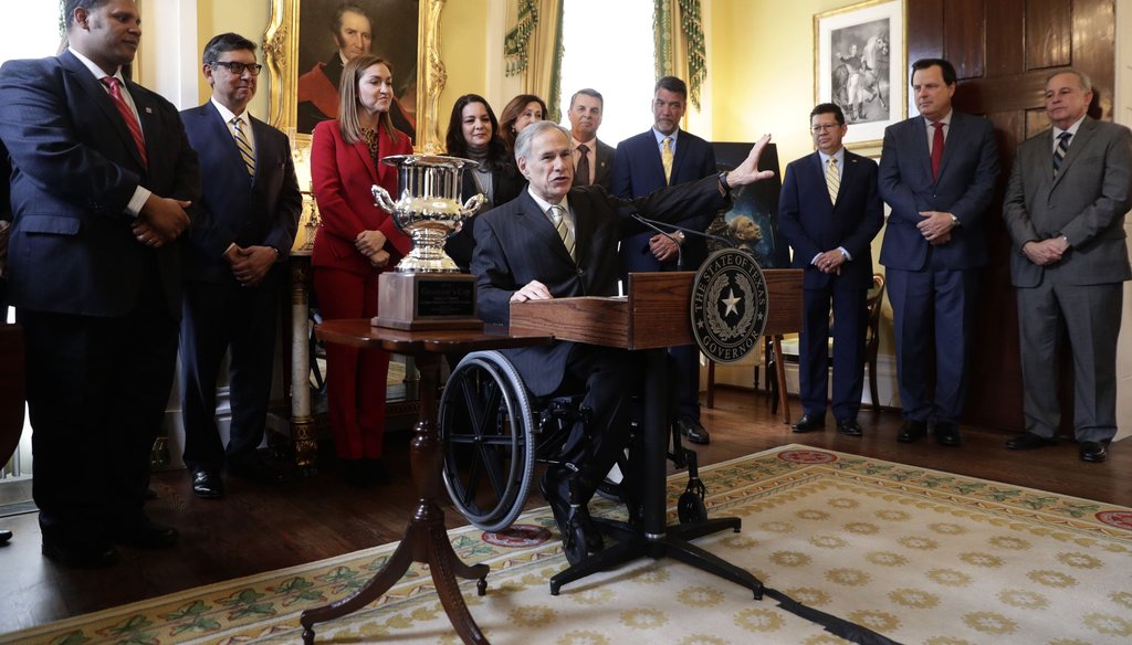 Texas Gov. Greg Abbott receives the Governor's Cup from Site Selection Magazine in Austin in March.(AP Photo/Eric Gay)