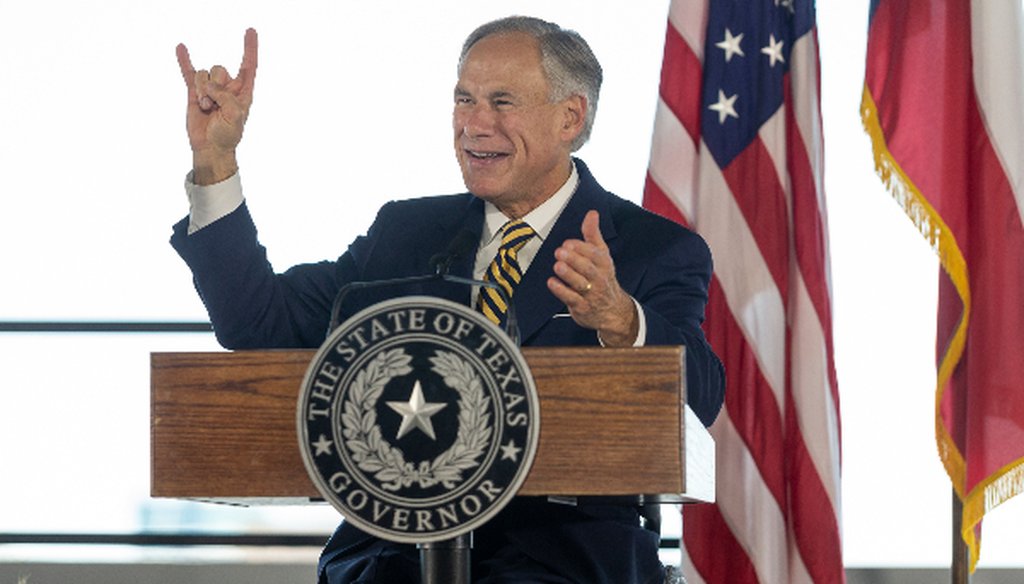 Texas Gov. Greg Abbott, offering a hook 'em Horns at an August 2018 event, hasn't fulfilled his campaign promise to place five Texas universities into the nation's top 10, PolitiFact Texas found (STEPHEN SPILLMAN, for Austin American-Statesman).