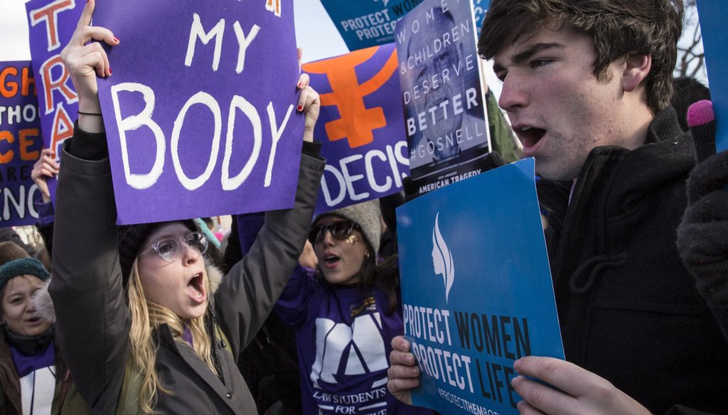 Pro-choice advocates, left, and anti-abortion advocates, right, rally outside of the Supreme Court on March 2, 2016 in Washington. (Drew Angerer / Getty Images.)