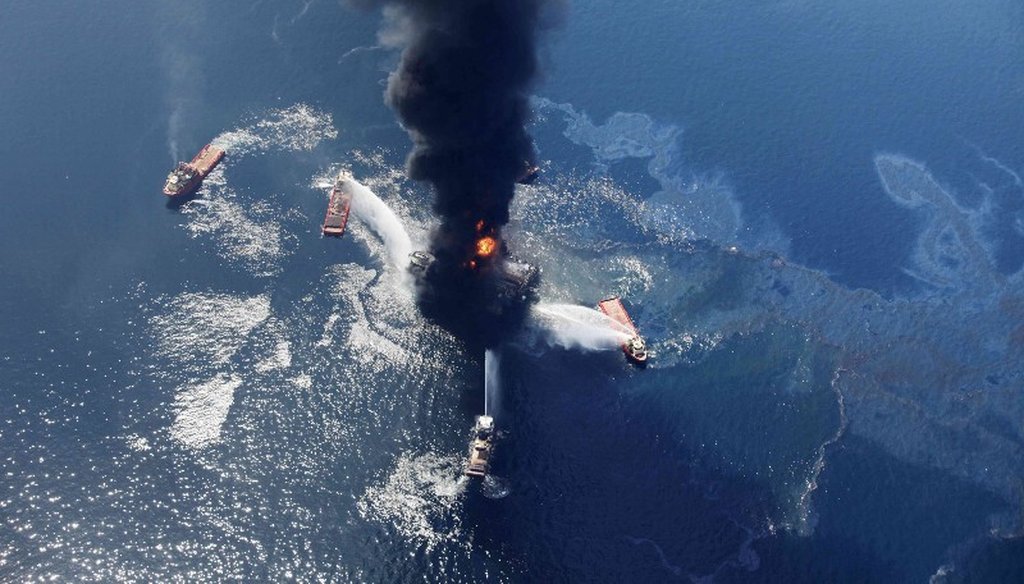 In this April 21, 2010 aerial file photo taken in the Gulf of Mexico more than 50 miles southeast of Venice on Louisiana’s tip, an oil slick is seen as the Deepwater Horizon oil rig burns. (AP Photo)