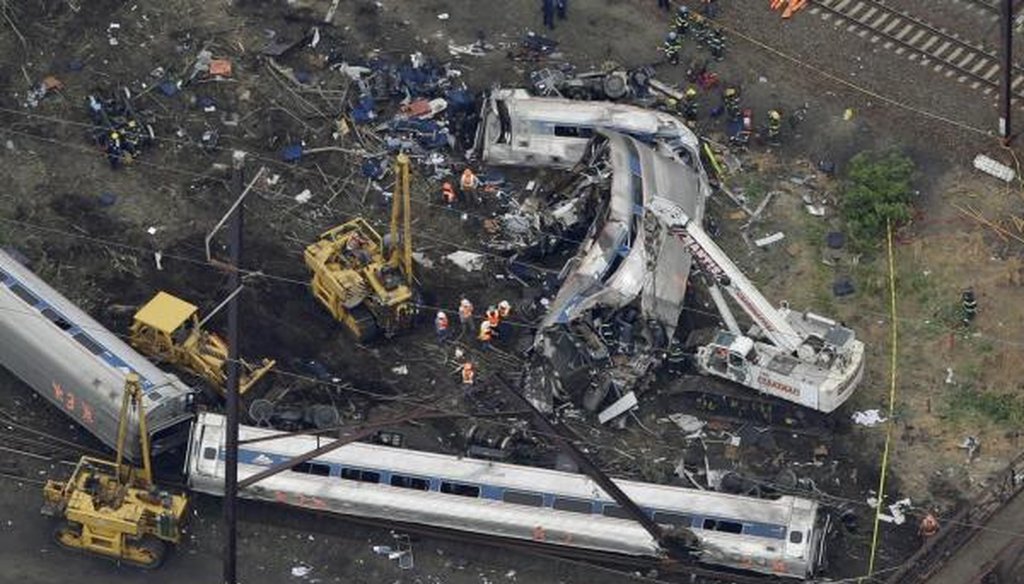 Emergency workers respond to the May 13, 2015, Amtrak train wreck in Philadelphia that killed eight people. (AP)
