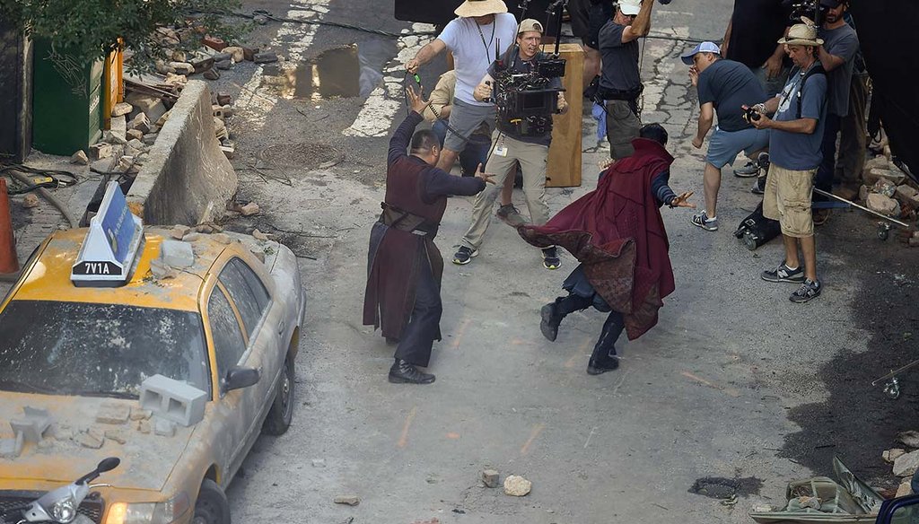 Actors Benedict Wong and Benedict Cumberbatch, from left, work during the filming of "Avengers: Infinity War, on June 27, 2017, in Atlanta. The set is modeled after a New York City street. (AP)