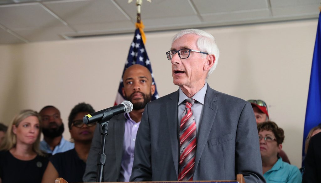 Gov. Tony Evers, center and Lt. Governor Mandela Barnes, left, spoke at a press conference on expanding Medicaid in Wisconsin on Aug. 5, 2019. Michael Sears/Milwaukee Journal Sentinel