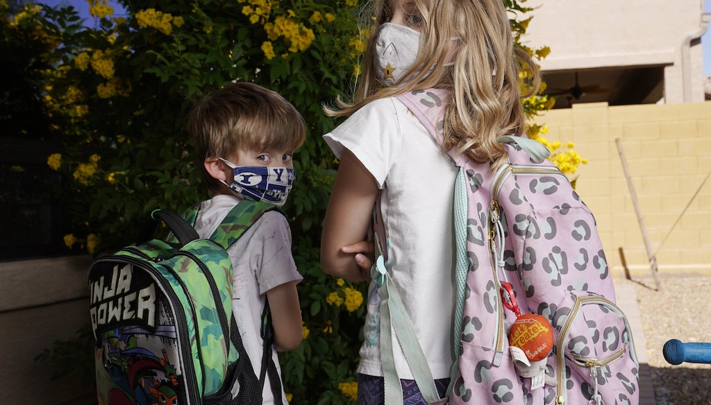 Angela Black, right, with her brother Luke Black at their home May 11, 2021, in Mesa, Ariz. The students attend a school where mask wearing is optional. (AP)
