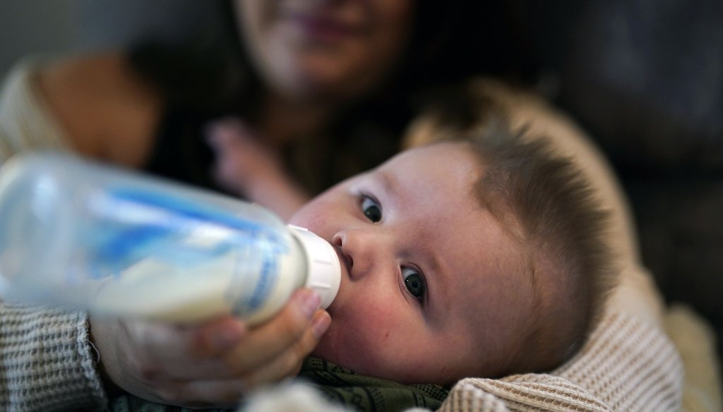 Ashley Maddox feeds her 5-month-old son, Cole, with formula she bought through a Facebook group of mothers in need on May 12, 2022, in Imperial Beach, Calif. (AP)