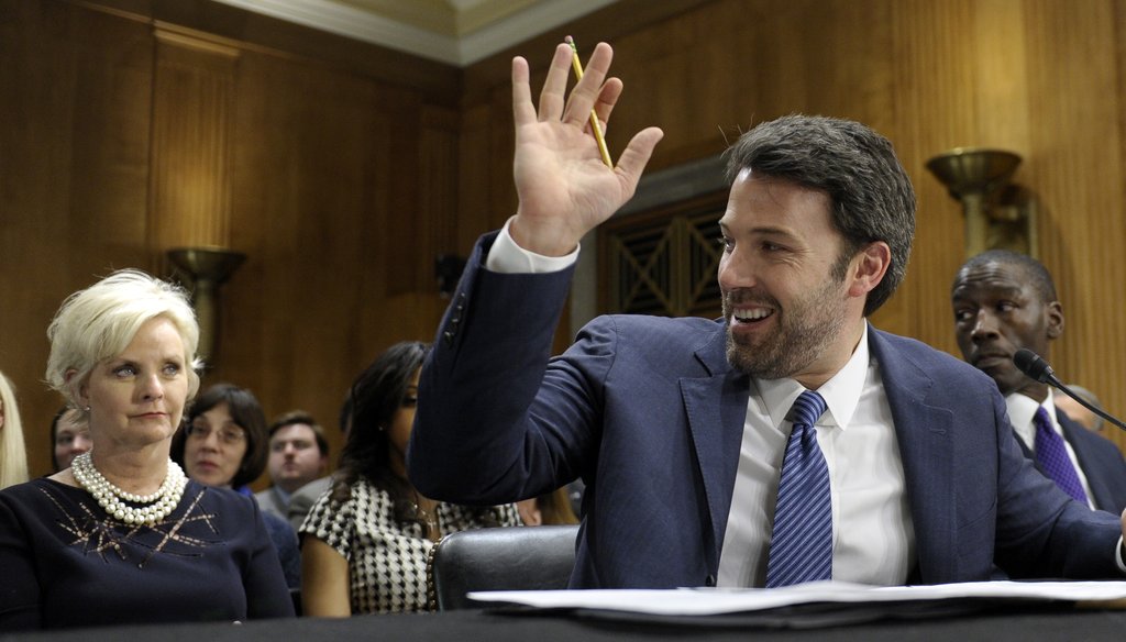 Ben Affleck testifies on Capitol Hill about his work in the Congo on Feb. 26, 2014, as Cindy McCain listens behind him. AP
