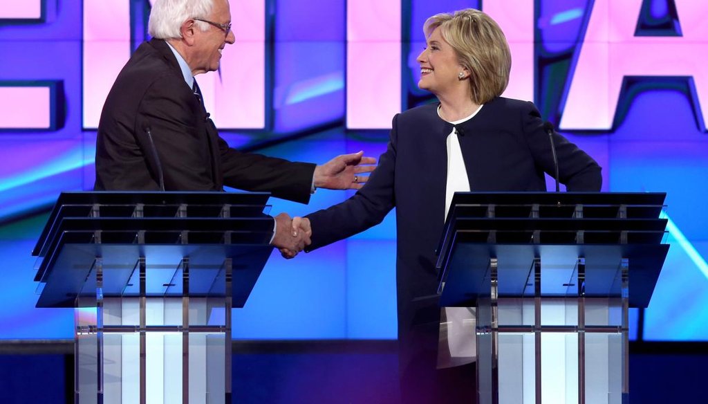 Vermont Sen. Bernie Sanders and former Secretary of State Hillary Clinton share a light-hearted moment at the end of the first Democratic debate in Las Vegas on Oct. 13, 2015. (Getty)