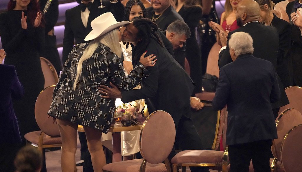 Beyoncé, left, and Jay-Z kiss in the audience on Feb. 4, 2024, during the 66th annual Grammy Awards in Los Angeles. (AP)